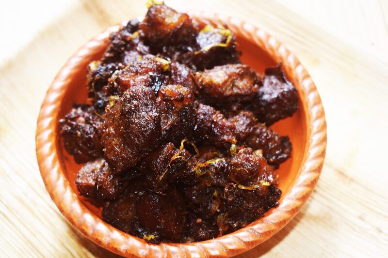 Bowl of dark, glossy Bangladeshi kala bhuna beef curry