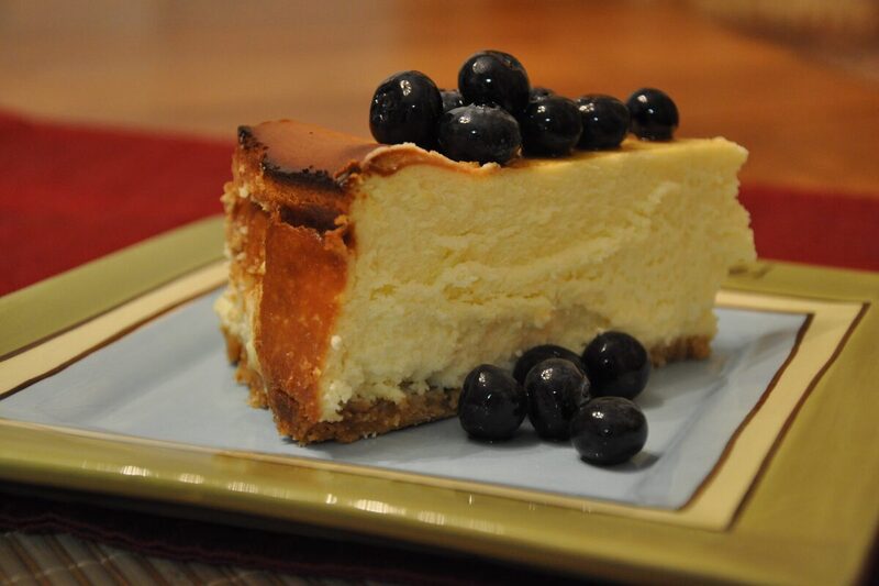 Slice of New York cheesecake with a graham cracker crust